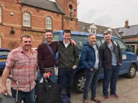men standing in front of taxi in Scunthorpe