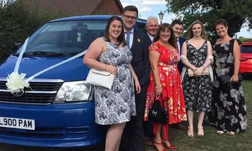 People ready for a wedding standing in front of pam's mini bus in Scunthorpe